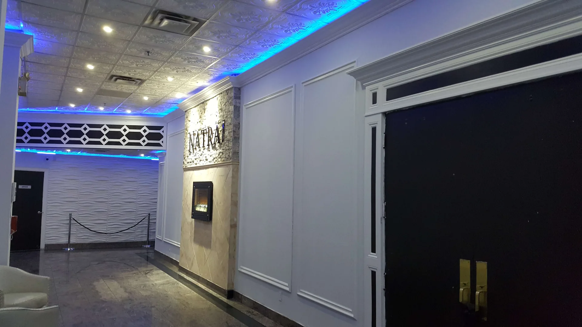 Entrance hallway washed in blue light on the way to the ballroom.