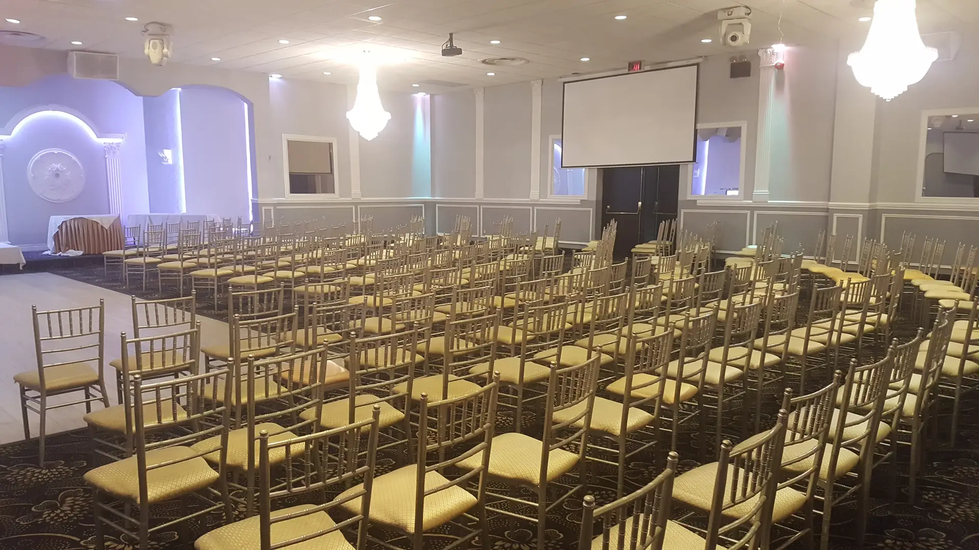 Theatre-style rows of chairs arranged for a corporate presentation or training day.